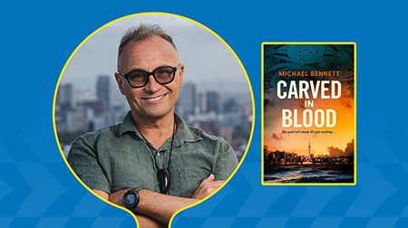 Author Michael Bennett with book cover titled Carved in Blood.