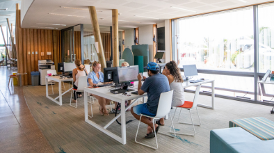 Photo of customers using public computers at a library