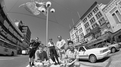Black and white photo from the 1990s of teens on Queens Street.