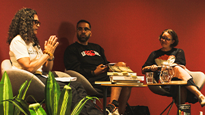 Three people having a discussion.