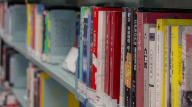 Library books on a shelf.