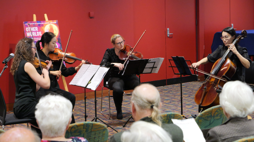 Classical music being played to an audience in Central City Library, Auckland.