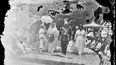An aged black and white photograph of Princess Sālote and others at her wedding in 1917.