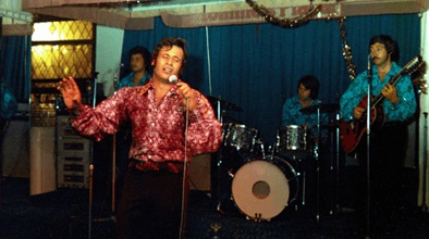 An old photograph of a band performing in a small venue