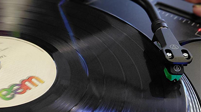 Close up of a vinyl record being played.