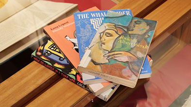 A fanned out stack of novels related to Pasifika stories