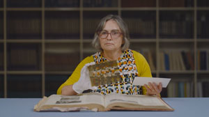 Heritage librarian Elspeth Orwin showing items from Auckland Council Libraries heritage collections.